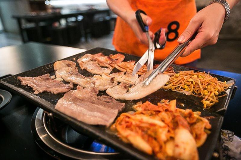 KBBQ - Eight Korean man cooking meats