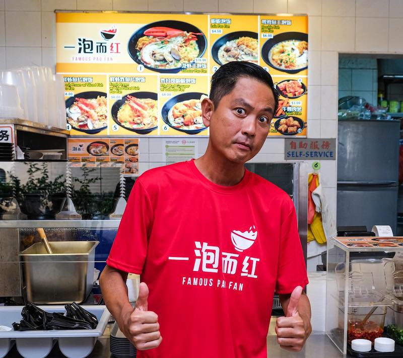 Chew Chor Meng infront of his celebrity-owned hawker, Famous Pao Fan