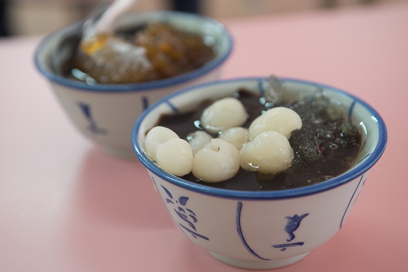 A bowl of Grass Jelly with longan and sea coconut