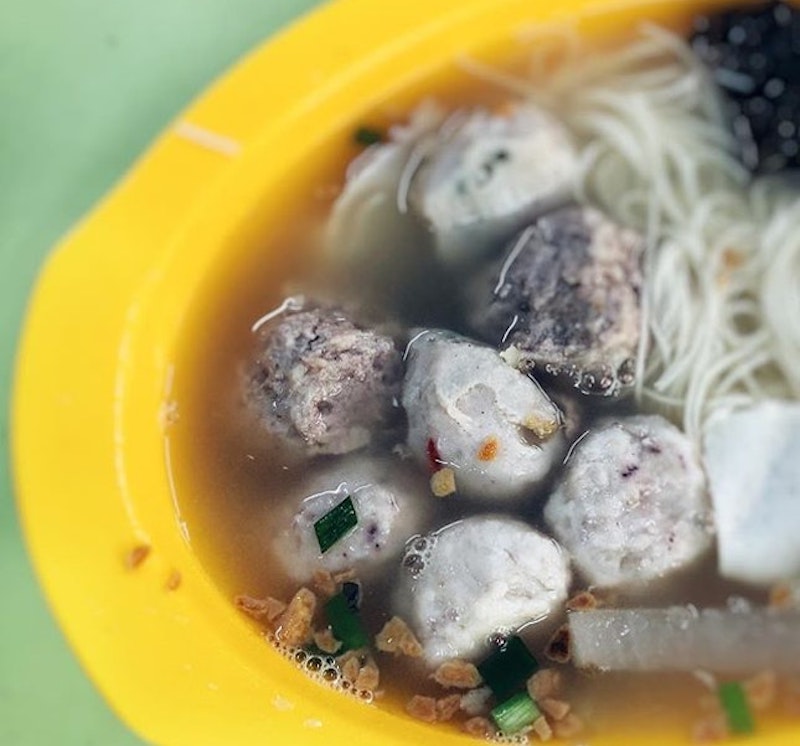 A bowl of Sotong Ball Seafood Soup with bee hoon