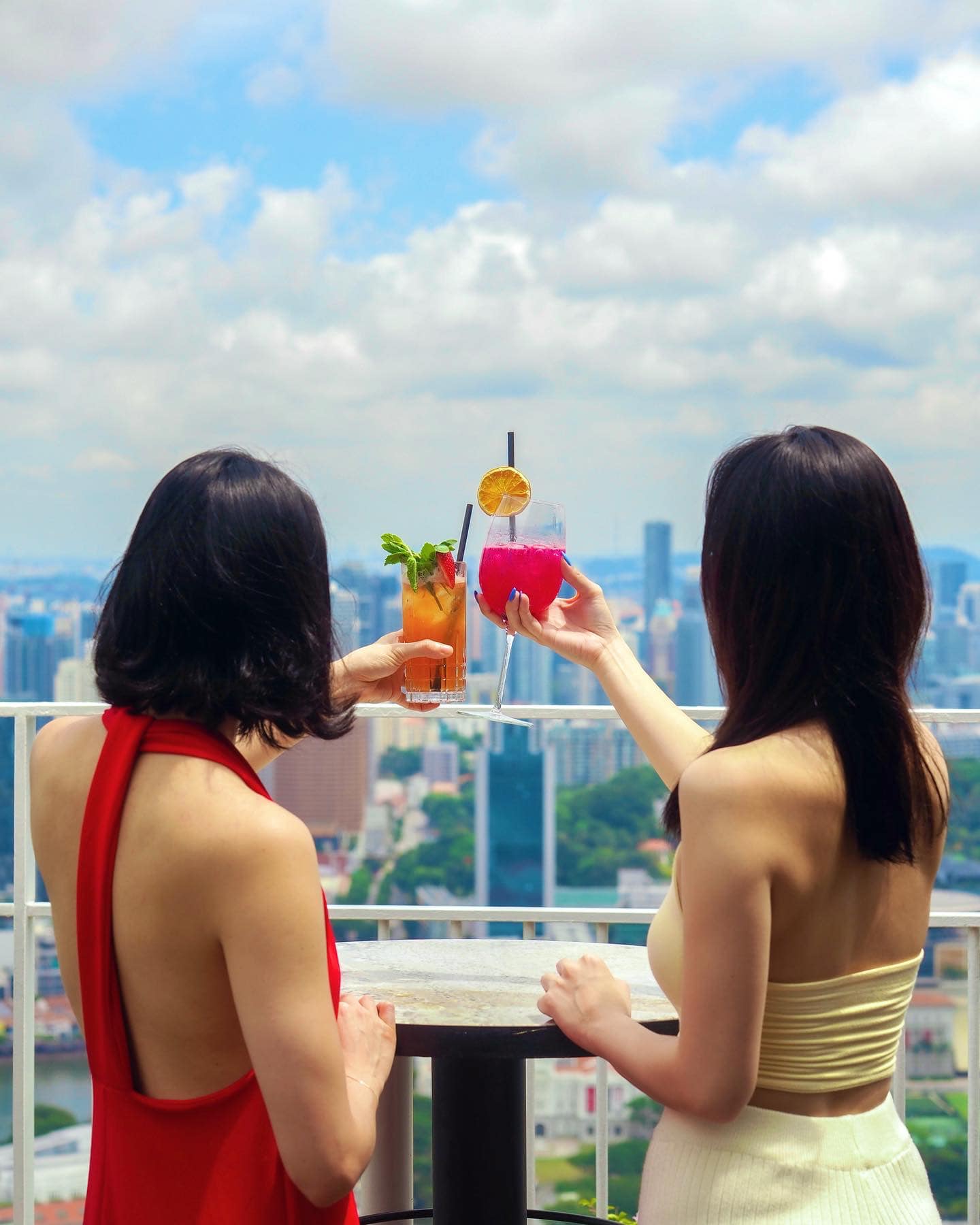 Photo of girls holding cocktails