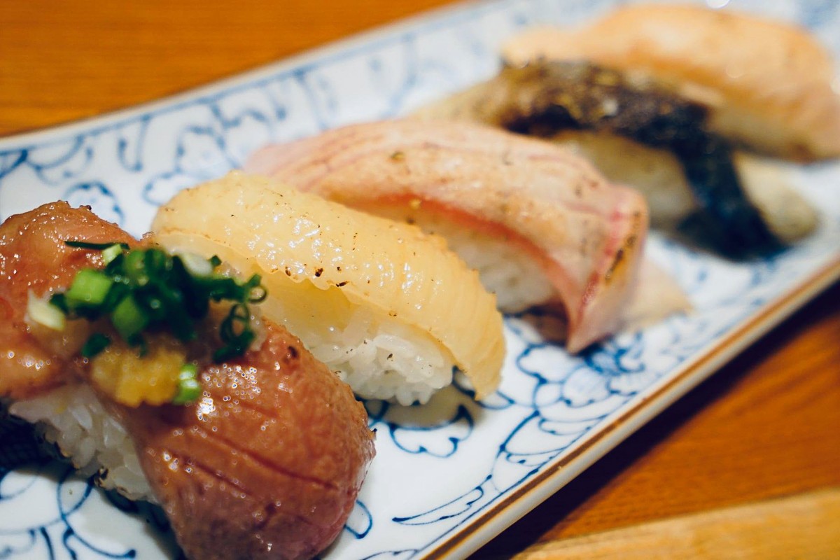 Five nigiri sushi on a plate
