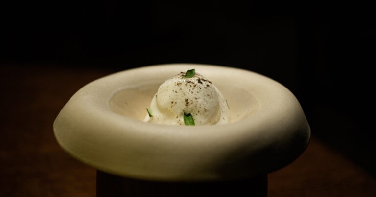a bowl of williams pear dessert with ice cream