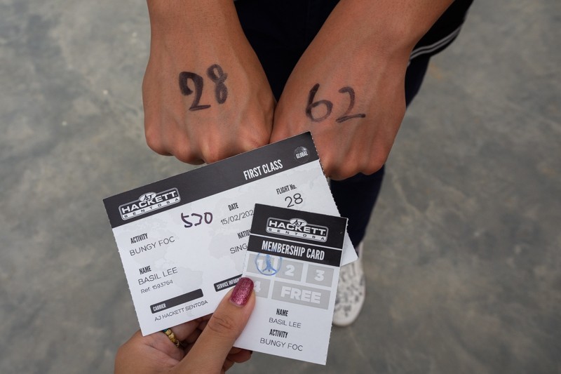Image of bungee ticket and markings on hand