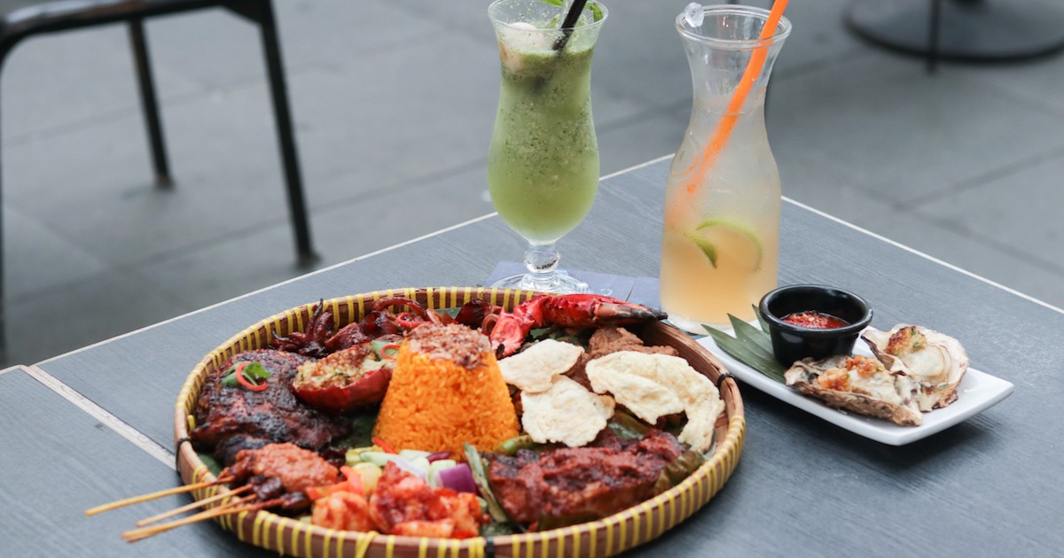 A table of dishes served at Bayang including their Supreme Nasi Campur and Grilled Oyster
