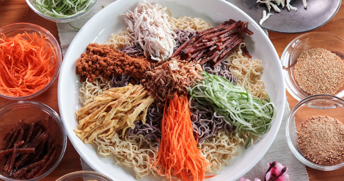 Picture of Top view of instant noodle yu sheng with condiments