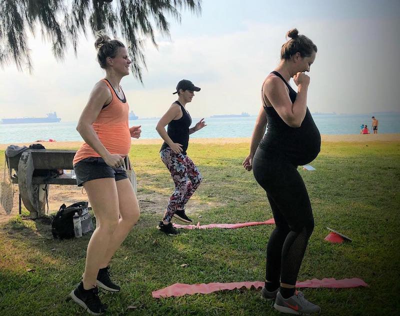 A group of pregnant ladies attending a prenatal fitness class