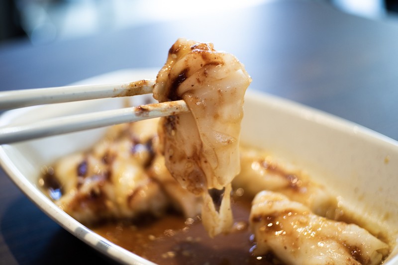 triple sauce rice noodle roll on chopsticks