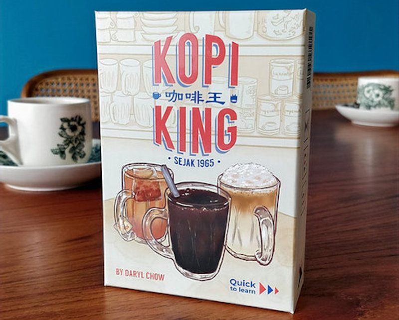 A deck of kopi king with cups in the background