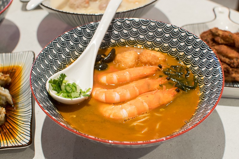 A bowl of lobster broth soup