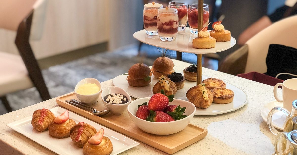 A side shot of three-tiered afternoon tea set