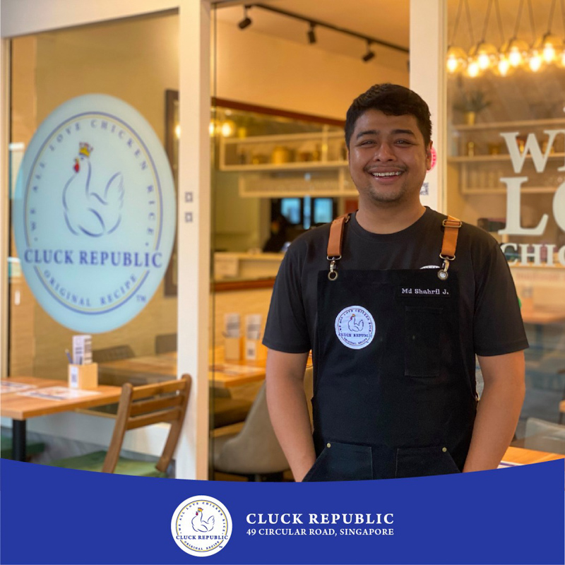 Image of Head Chef Shahril with shopfront of Cluck Republic