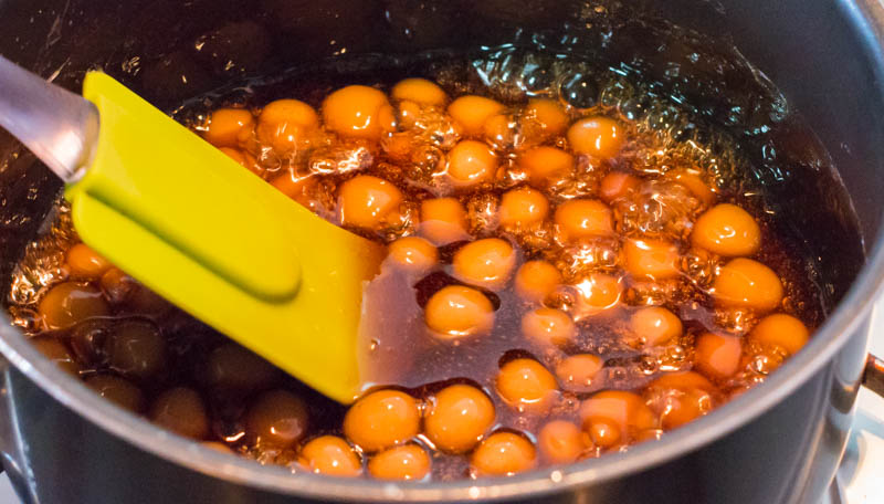 A pot of tapico pearls that is being cooked in sugar syrup