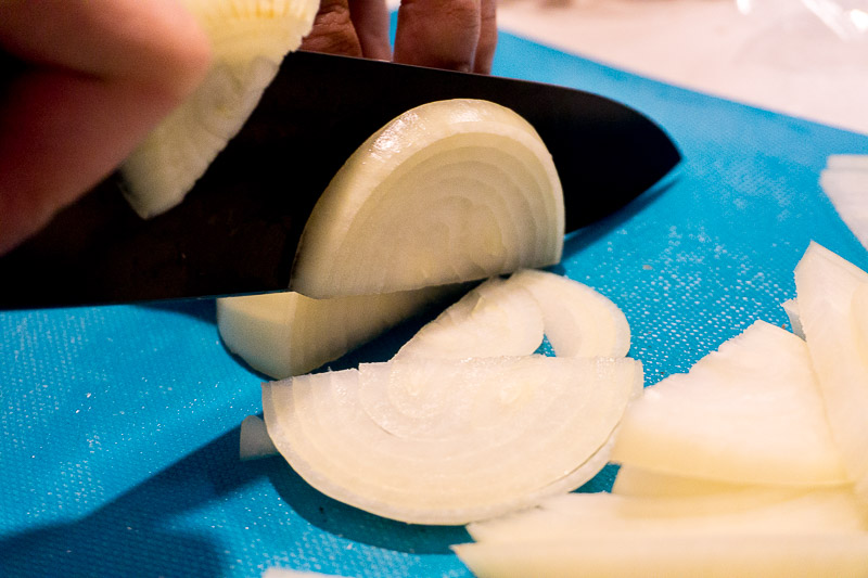 Slicing onions for Lemony Braised Chicken Legs
