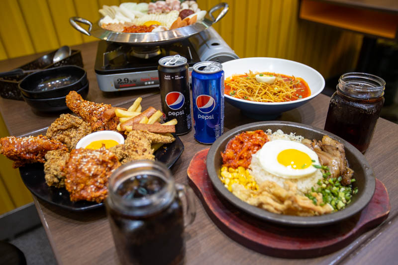 Table of Korean food with Pepsi