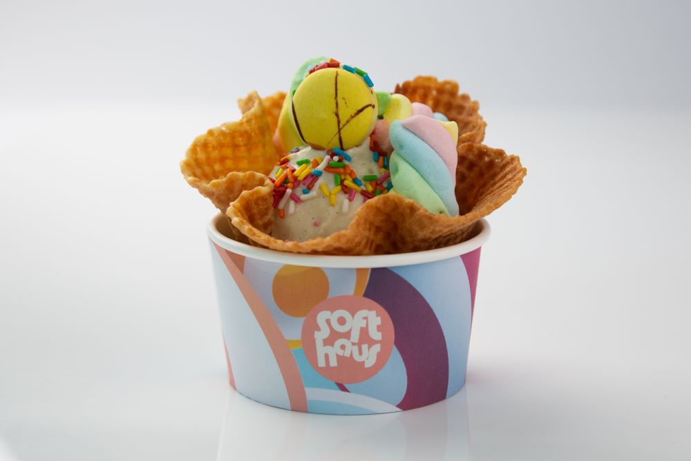 Ice cream waffle cup with assortment of tppings