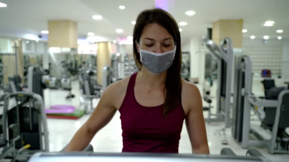 Woman working out with mask