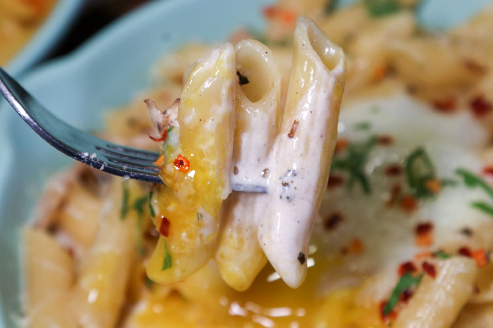 a close up of penne pasta