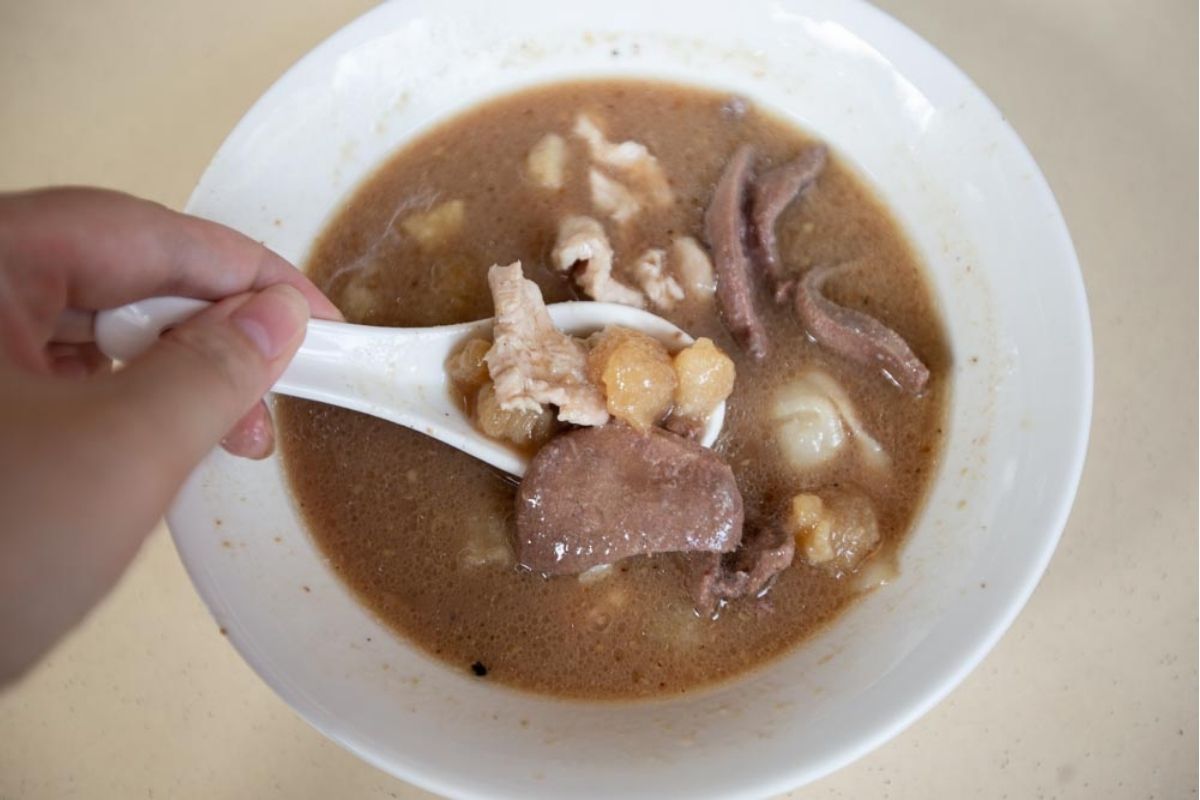 No. 25 Minced Meat Noodle - Scooping Soup Ingredients