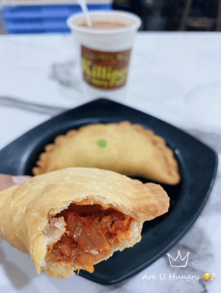 holding up a curry puff