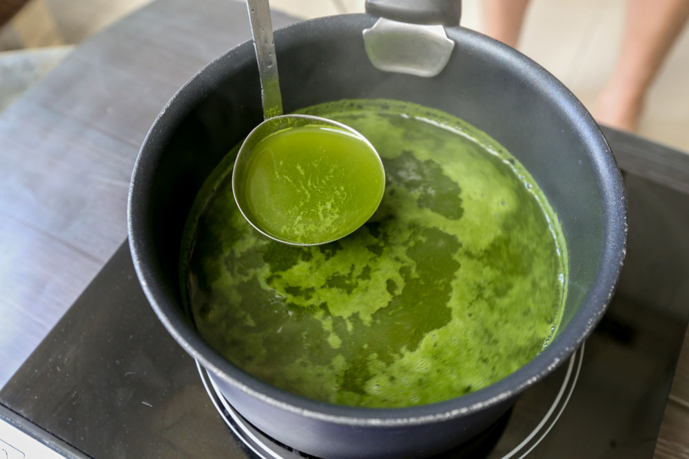 Close up of matcha powder in boiling water