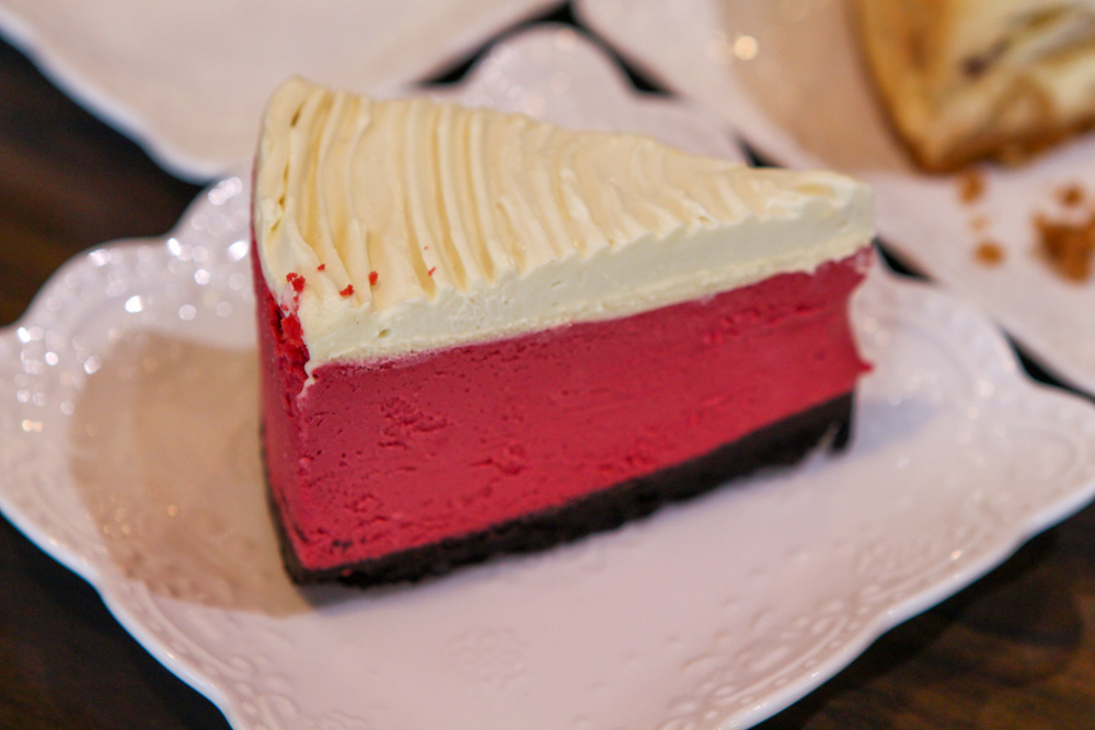 Image of a slice of red velvet cheesecake 