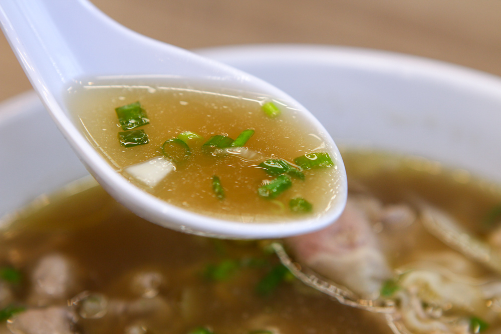 Chef Minh - close up of a spoonful of broth