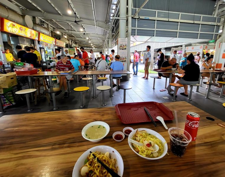 mei ji - hawker centre table with food