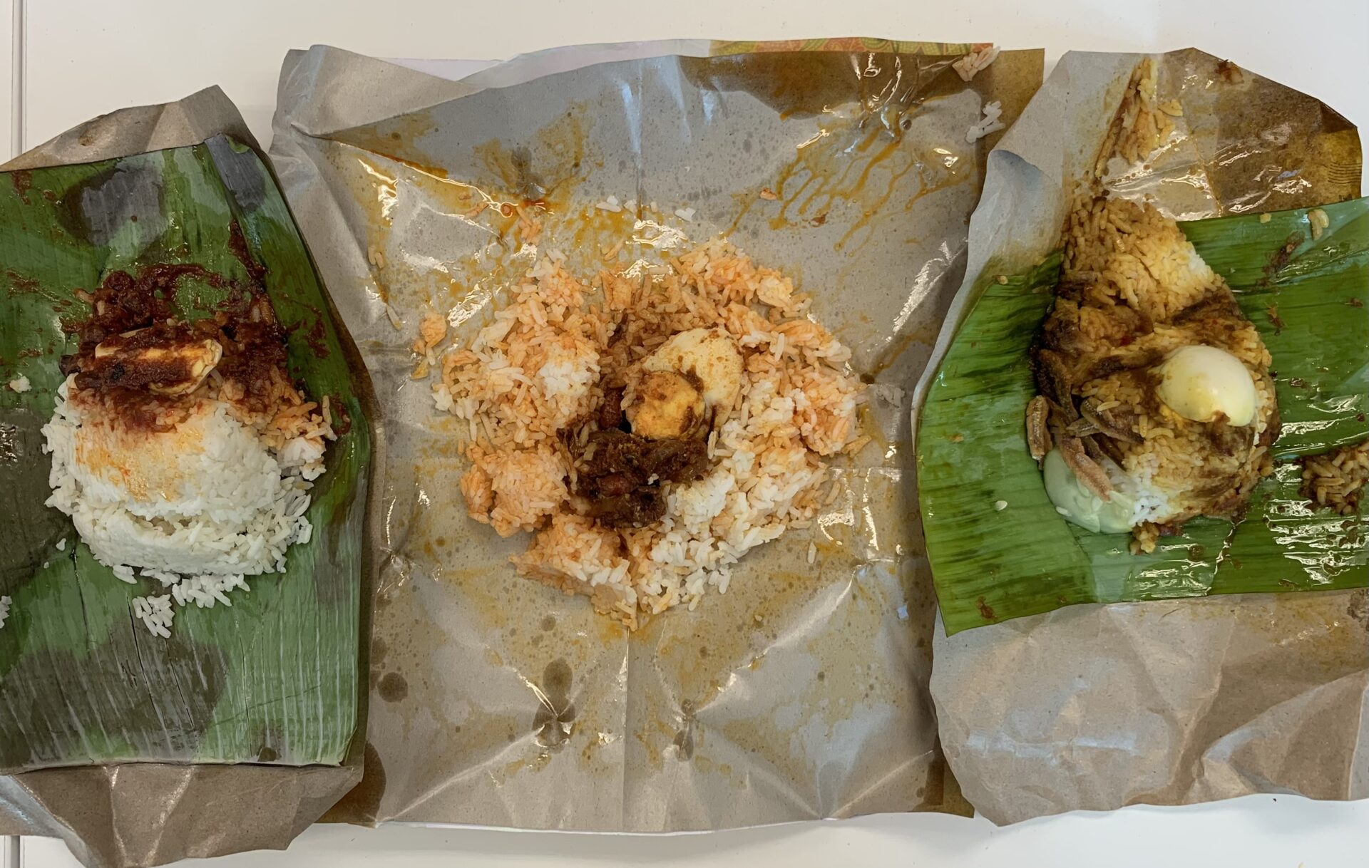 All three packets of open nasi lemak