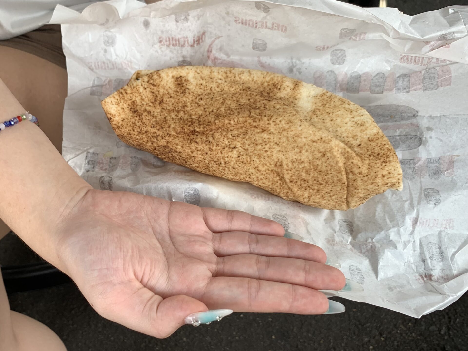 Dhon Burger - Size comparison between hand and shawarma
