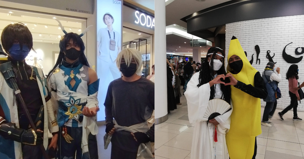 Cosplayers posing and standing for a picture