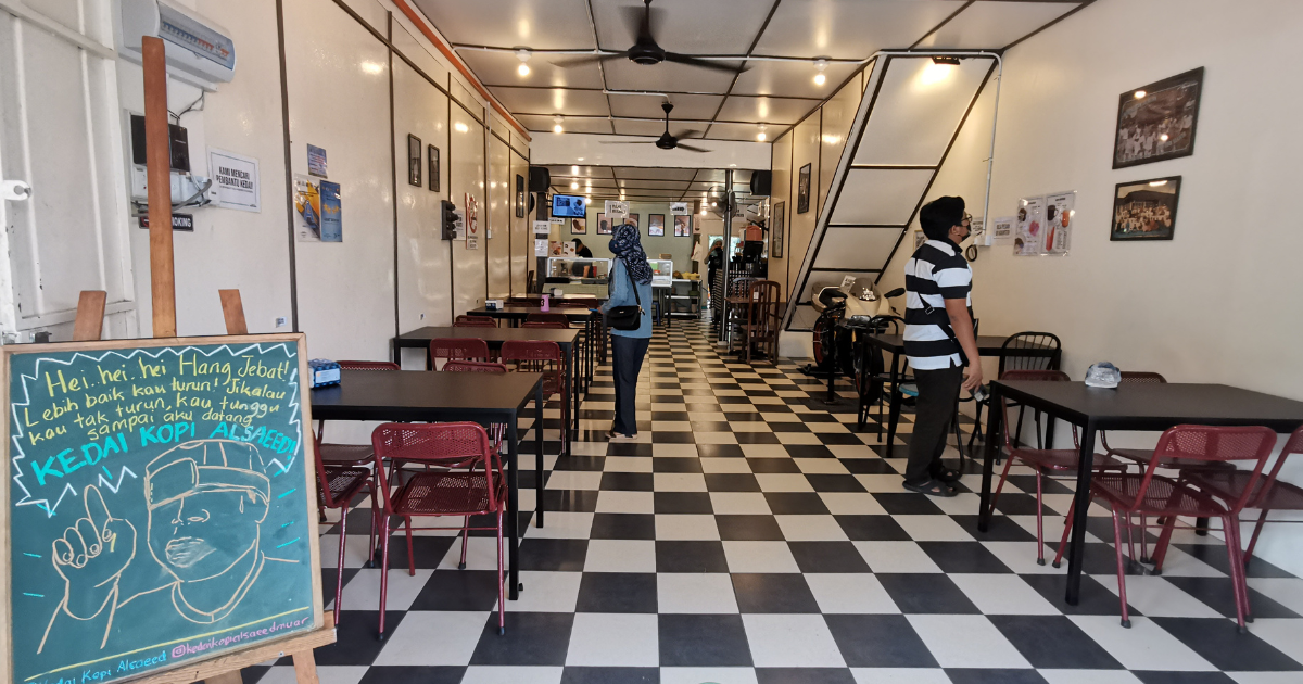 Kedai Kopi Alsaeed - interior of the restaurant with a chalkboard near the entrance