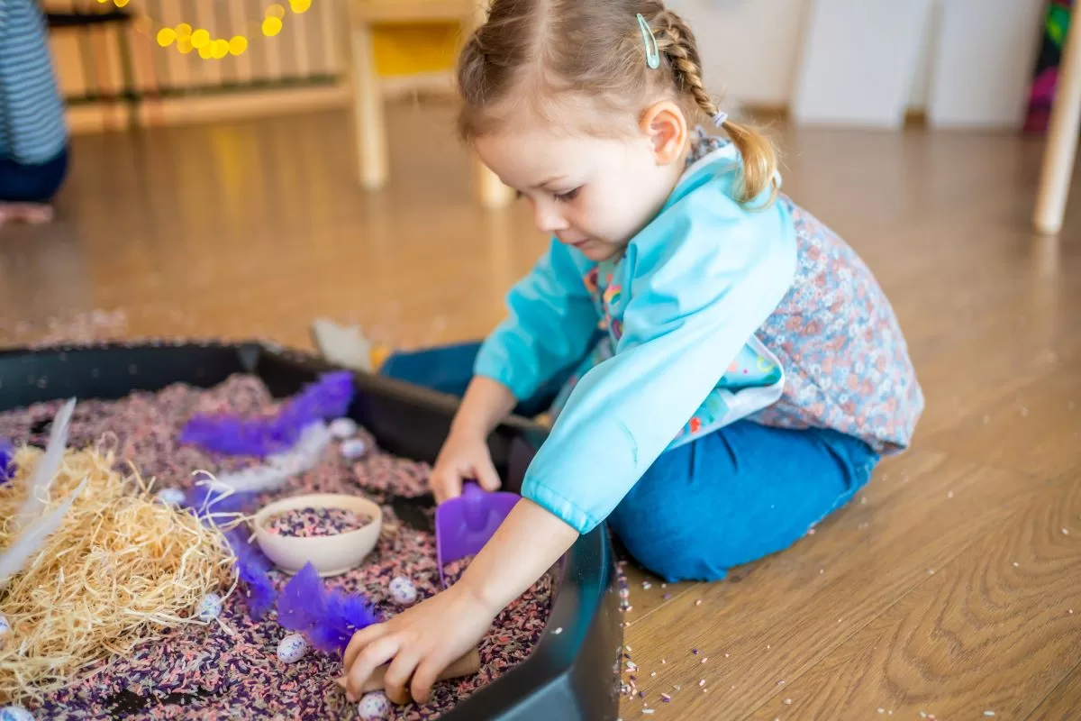 kidsstop mess-ive science party - girl playing with sand