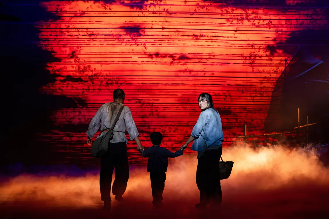 misssaigon - adults holding child's hands