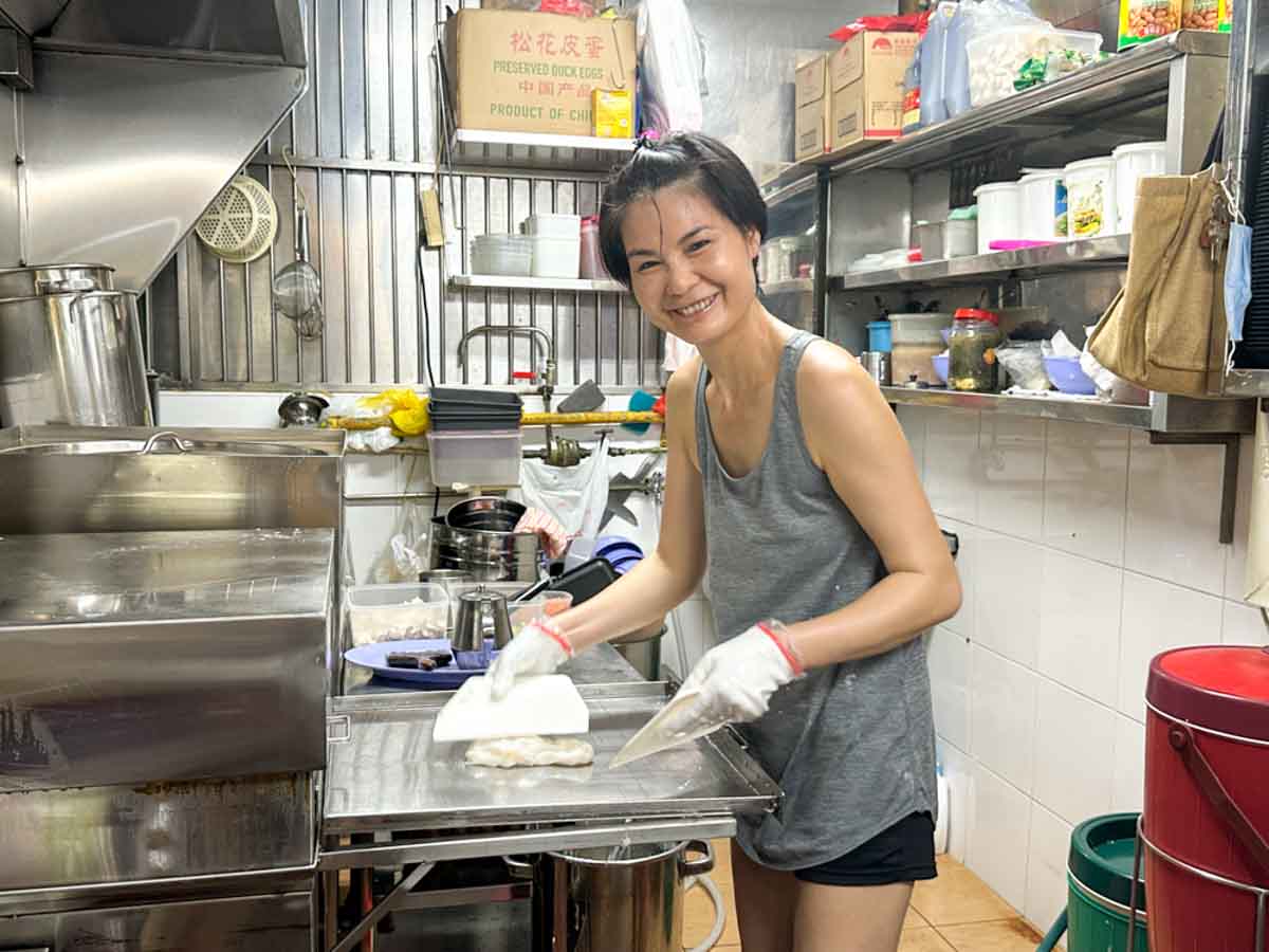 yong huat delights - owner smiling
