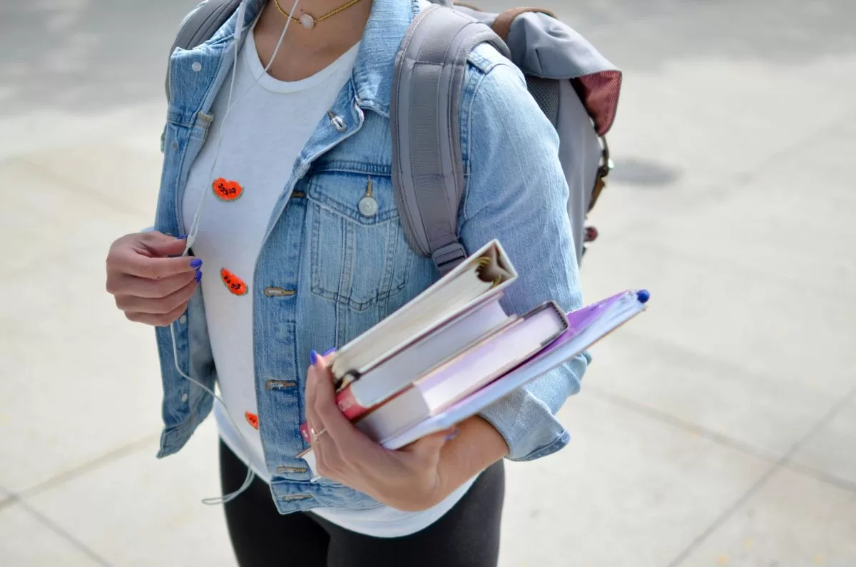 march holiday camp - person carrying book march holiday camp - person carrying book