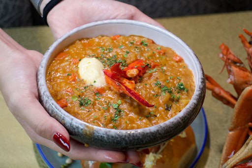 lobsterfest - holding bowl of risotto