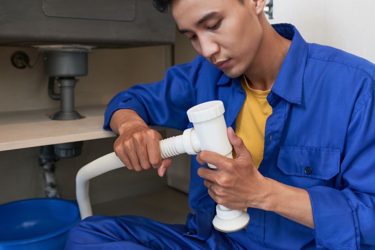 Best Plumbing Company - Man Repairing Pipe