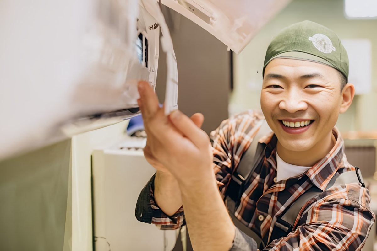 Aircon servicing - StringsSG 1 - smiling technician