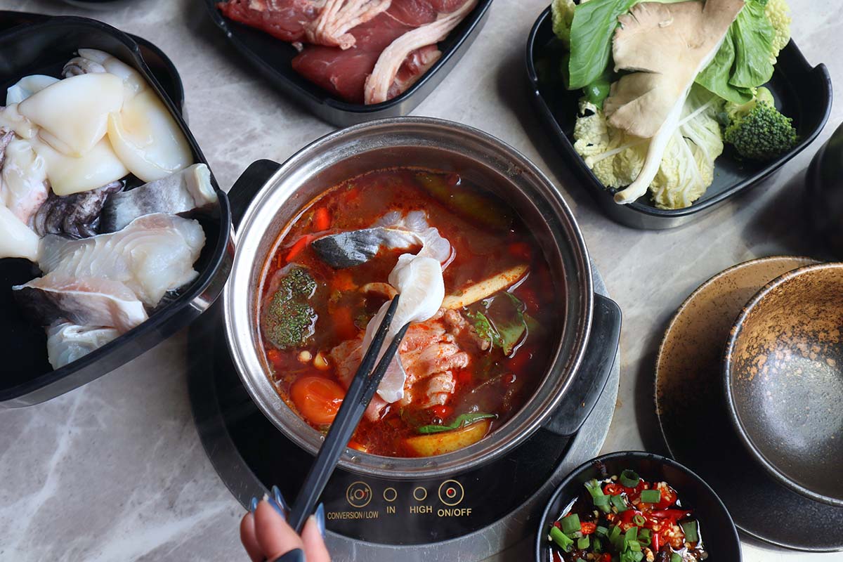 hotpot places singapore - cooking meat