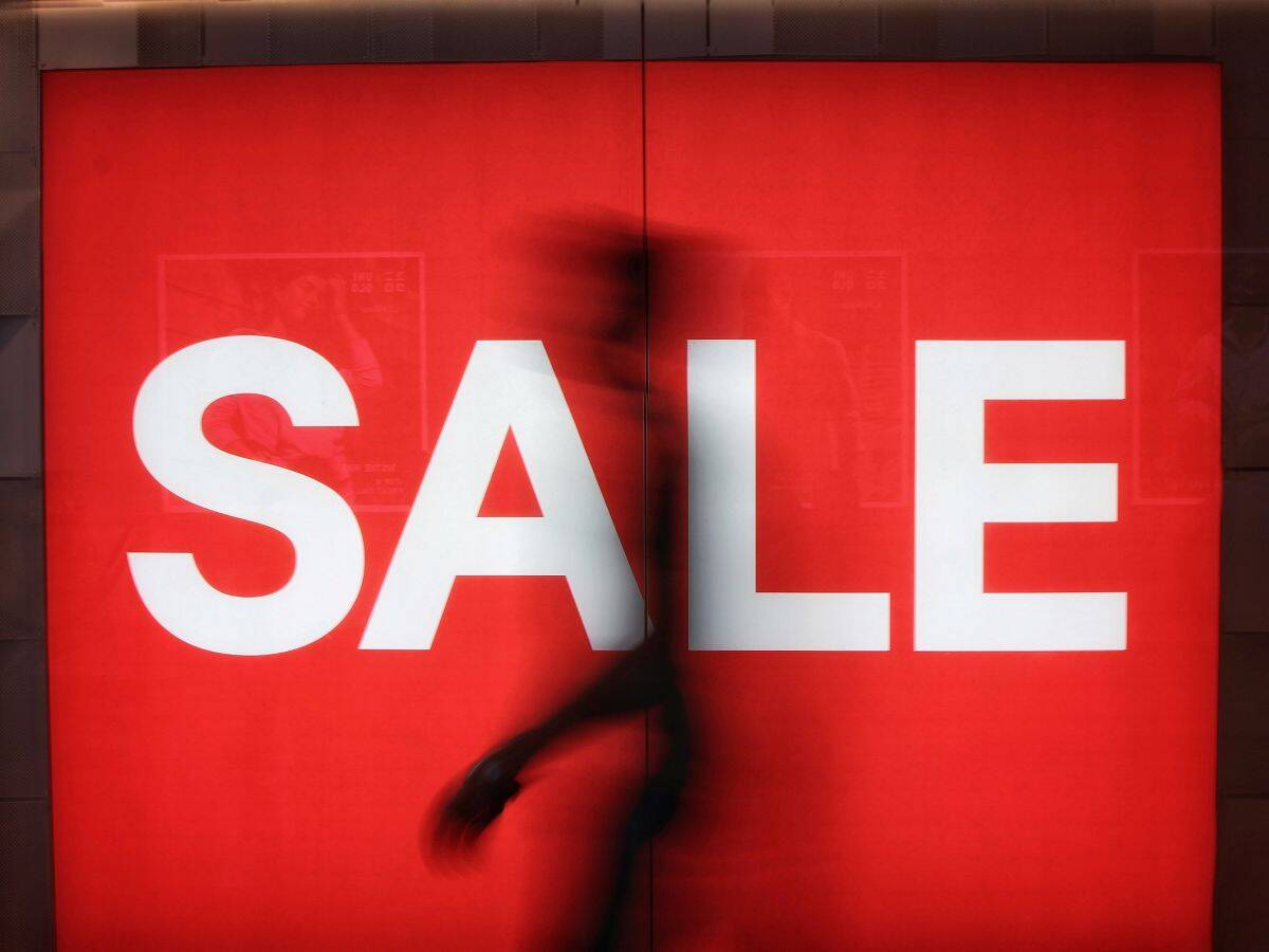 Singapore Retail Festival - Image of Person Walking Under Sale