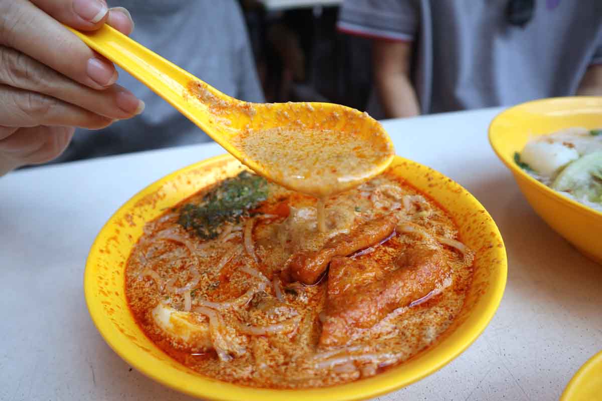 no name prawn mee - laks broth closeup