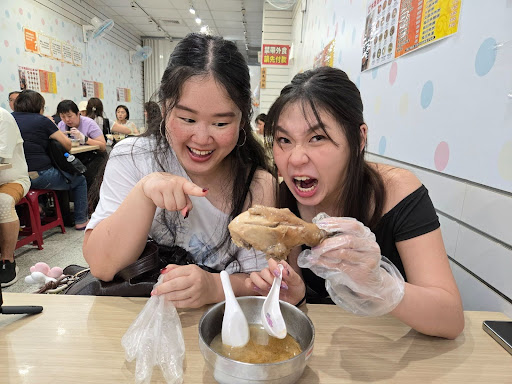 taiwan - girls eating chicken leg