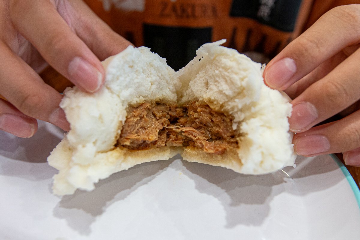 Warung Dimsum - chicken pau torn open Warung Dimsum - chicken pau torn open