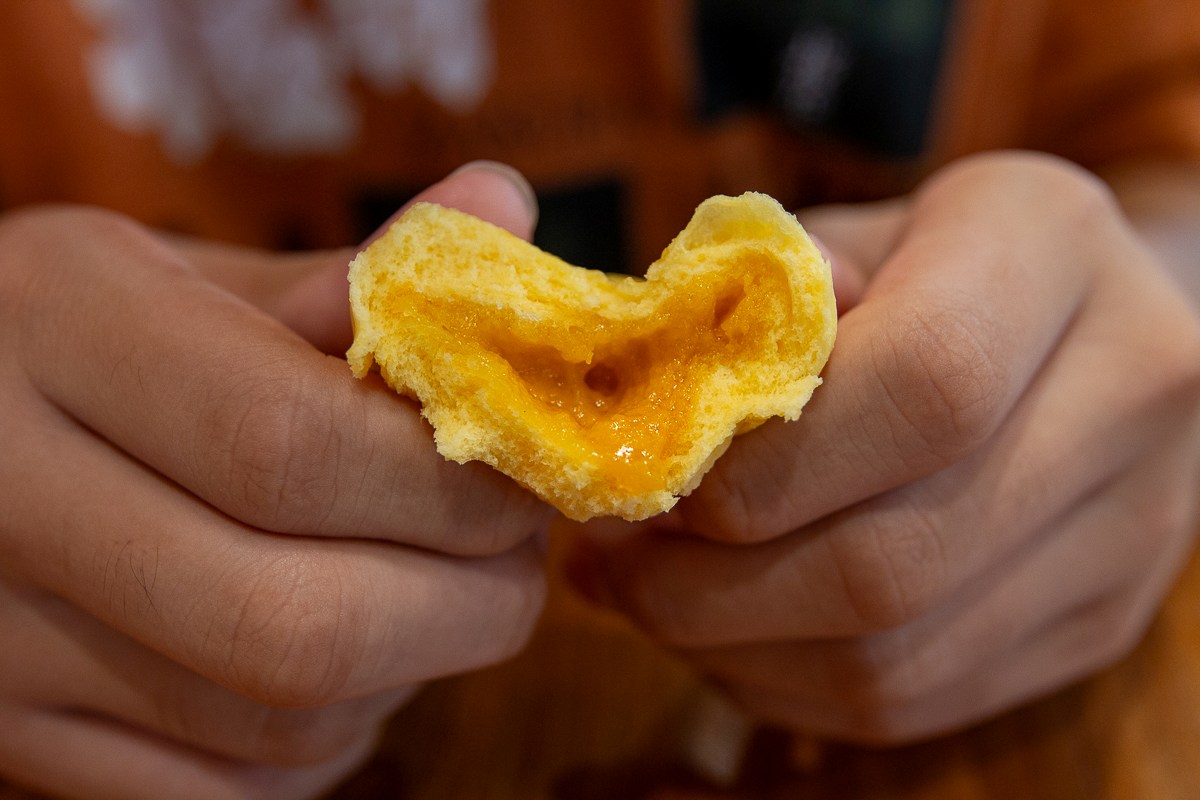 Warung Dimsum - salted egg pau cross section Warung Dimsum - salted egg pau cross section