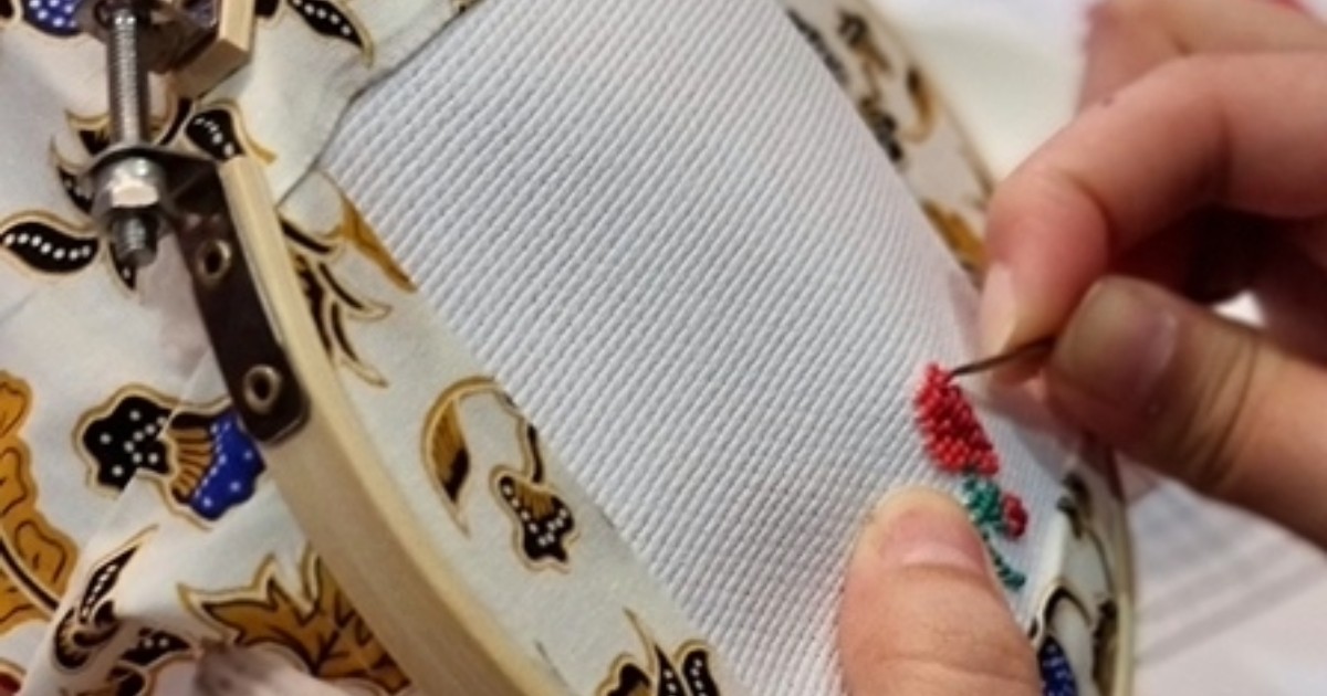 Image of a person making a Peranakan Beading piece