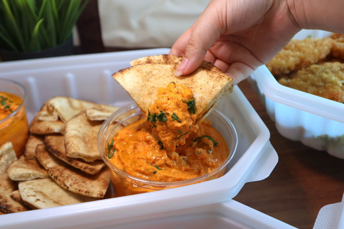 caterwow - pita bread dipped in sauce