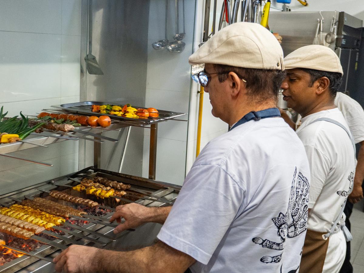 Shirazi - Chef grilling meat