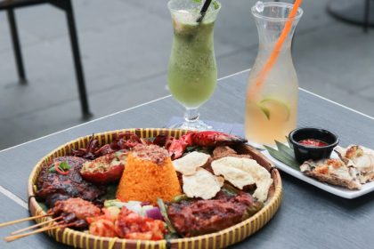 A table of dishes served at Bayang including their Supreme Nasi Campur and Grilled Oyster