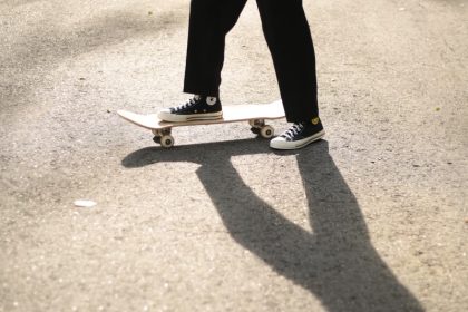 Model with his foot on a skateboard